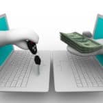 Two white cartoon laptops facing one another with white hands coming out of the blue screens, one holding a car key, the other holding a stack of cash