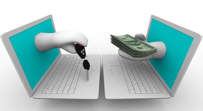 Two white cartoon laptops facing one another with white hands coming out of the blue screens, one holding a car key, the other holding a stack of cash