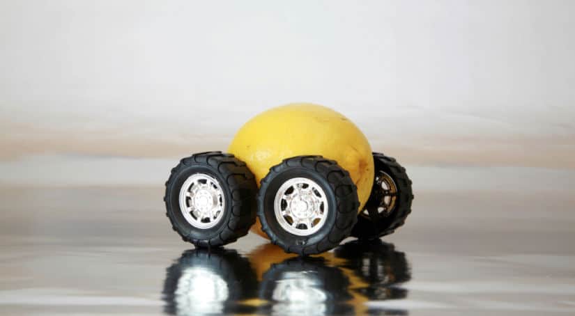 Yellow lemon on silver wheels and black tires