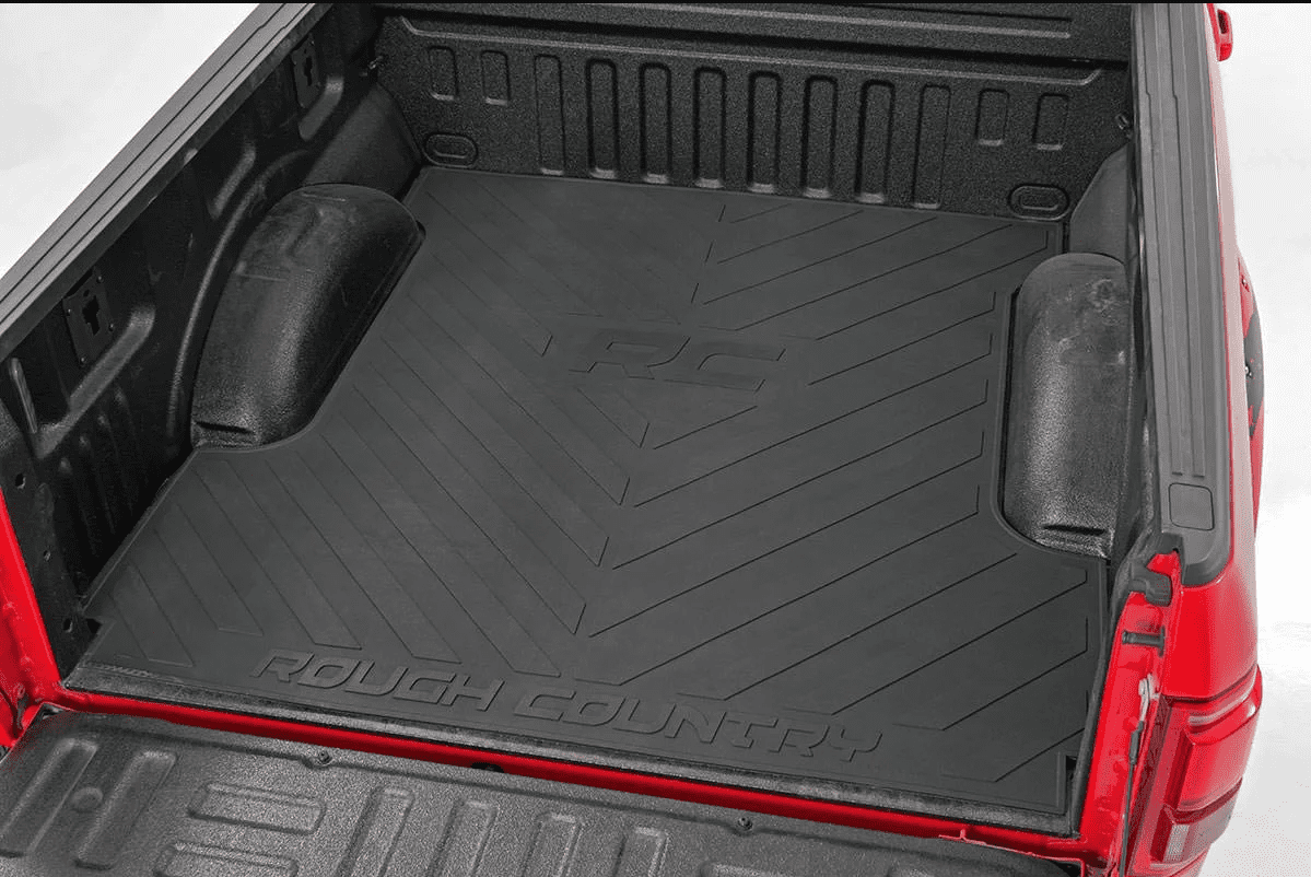 A bed mat in a red truck
