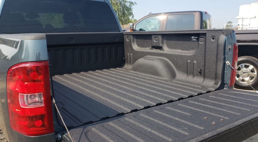 A Chevy truck with a spray on bed liner