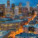 Tall buildings with many lit up windows