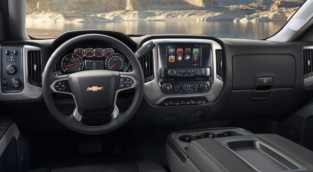 Black and silver dashboard of 2019 Chevy Silverado 3500 interior