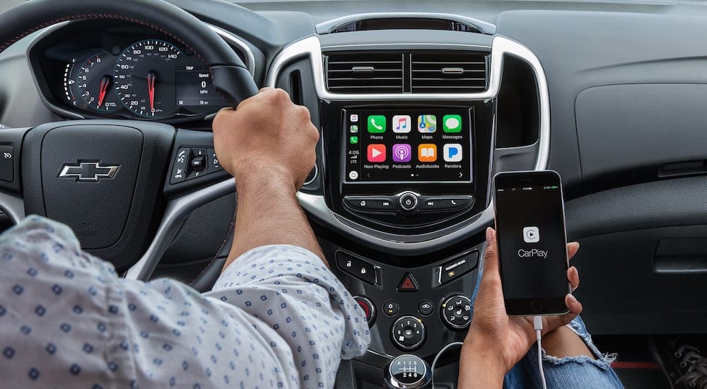 A phone connecting to a 2019 Chevy Sonic infotainment screen