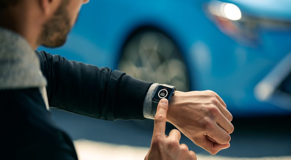 Man remote starting his 2019 Toyota Corolla via a smartwatch