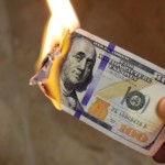 A 100 hundred dollar bill on fire