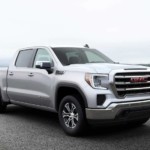 Silver 2019 GMC Sierra 1500 with ocean in back