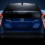 Dark blue 2019 Toyota Prius in low light, facing tailgate