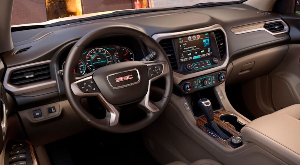 The leather interior and dashboard of a 2019 GMC Acadia Denali