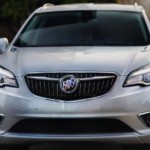 A white 2019 Buick Envision in a city