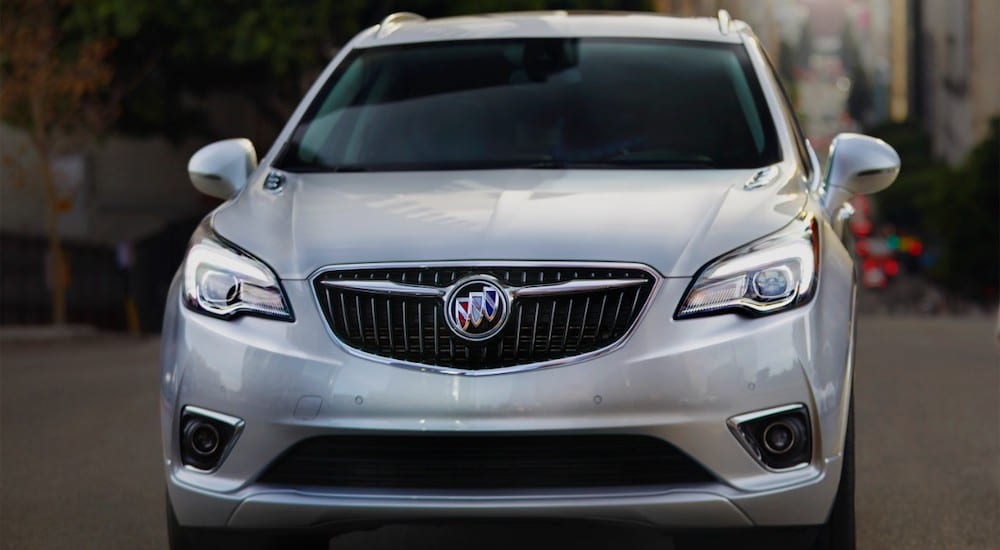 A white 2019 Buick Envision in a city