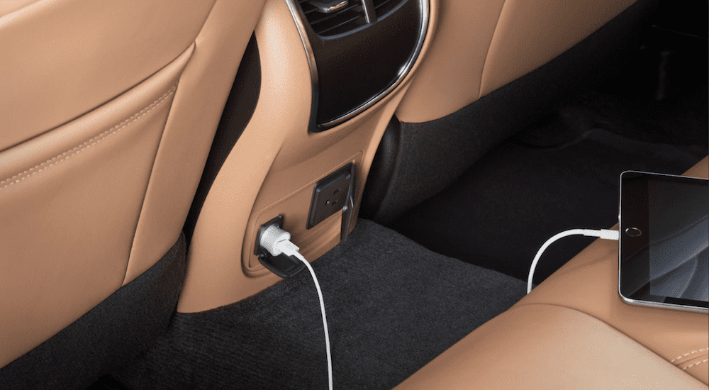 A closeup of the back seat charging ports in a 2019 Buick LaCrosse