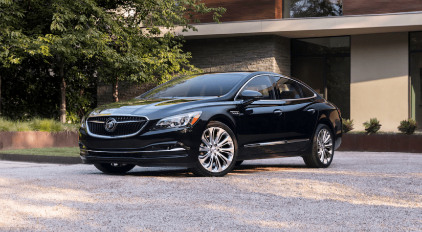 A black 2019 Buick LaCrosse in front of a house