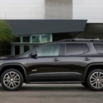 A black 2019 GMC Acadia All Terrain parked in a driveway