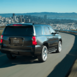 A black 2019 Chevy Tahoe drives away with the win for 2019 Chevy Tahoe vs 2019 Nissan Armada