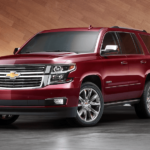 A red 2019 Chevy Tahoe in a wooden display room