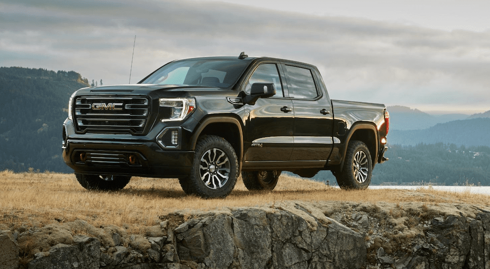 A black 2019 GMC Sierra 1500 sits proudly on a sea side cliff
