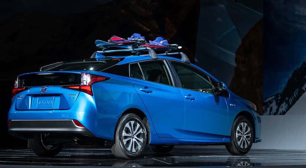 A blue 2019 Toyota Prius AWB at a current auto news announcement