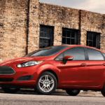 A red 2019 Ford Fiesta on a test derive from a local Ford Dealership