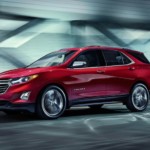 A red Equinox drives off victorious from 2019 Chevy Equinox vs 2019 Mazda CX-5