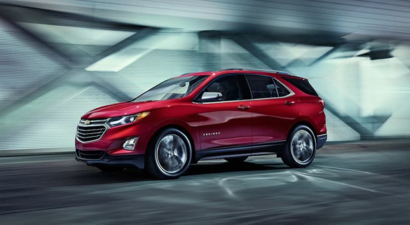 A red Equinox drives off victorious from 2019 Chevy Equinox vs 2019 Mazda CX-5