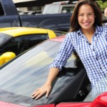 Smiling woman showing off the keys to her new car