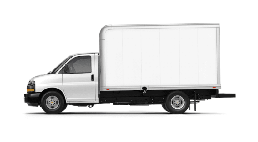A 2019 Chevy Express Cutaway with a Hicube style cargo setup is shown on a white background. Box trucks for sale can be found at a Chevy commercial dealer.