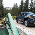 A blue 2019 GMC Sierra 2500HD Denali is on a bridge.