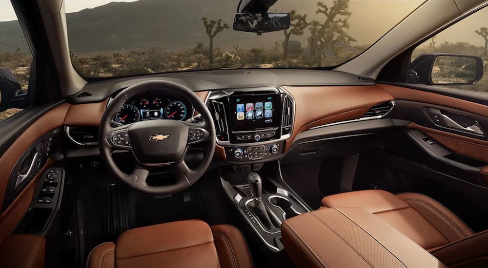 The brown interior of the 2019 Chevy Traverse is shown. Look at interior features when comparing the 2019 Chevy Traverse vs 2019 Honda Pilot.