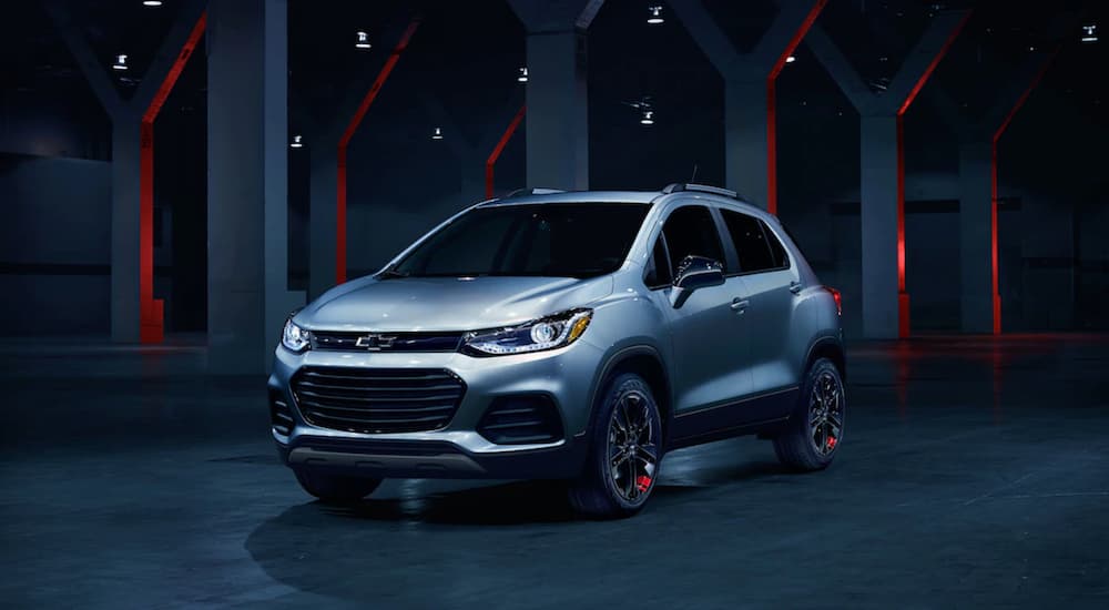 The 2019 Chevy Trax Redline Edition is shown in a dark showroom. Comparing styling when looking at the 2019 Chevy Trax vs 2019 Honda HR-V. 
