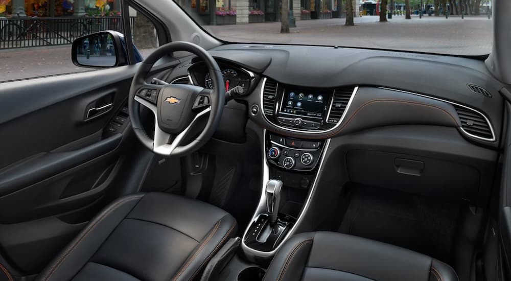 The black interior of the 2019 Chevy Trax is shown. Check out features when comparing the 2019 Chevy Trax vs 2019 Nissan Kicks.
