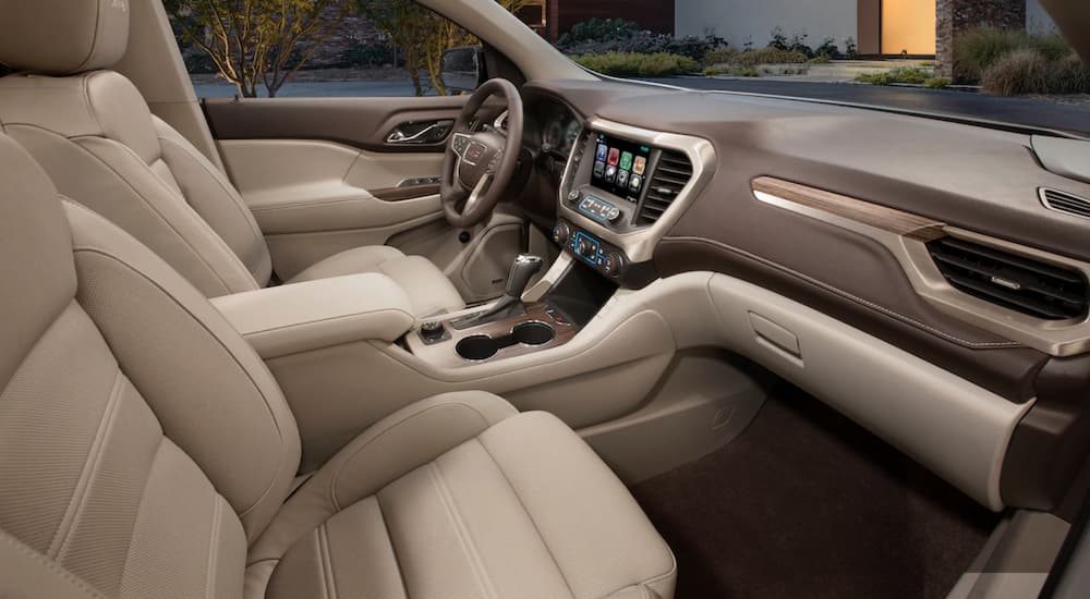 The tan interior of the 2019 GMC Acadia Denali shows why it wins in luxury when comparing the 2019 GMC Acadia vs. 2019 Toyota Highlander.