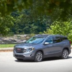 A gray Terrain parked in front of a river after winning 2019 GMC Terrain vs 2019 Ford Escape