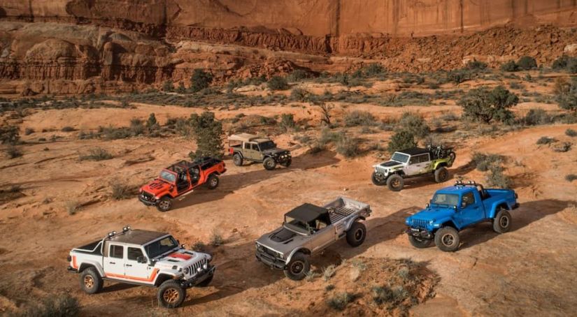 The lineup of concept Jeeps at the 2019 Moab Utah Easter Jeep Safari in current auto news is shown in front of the red rocks.