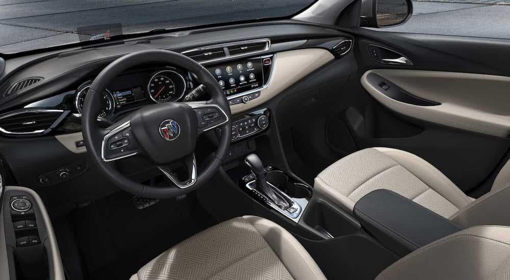 The black and cream interior of the 2020 Buick Encore GX is shown.