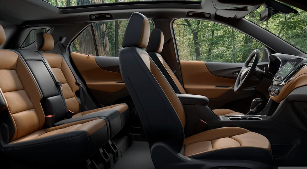The black and brown interior of the 2019 Chevy Equinox is shown.