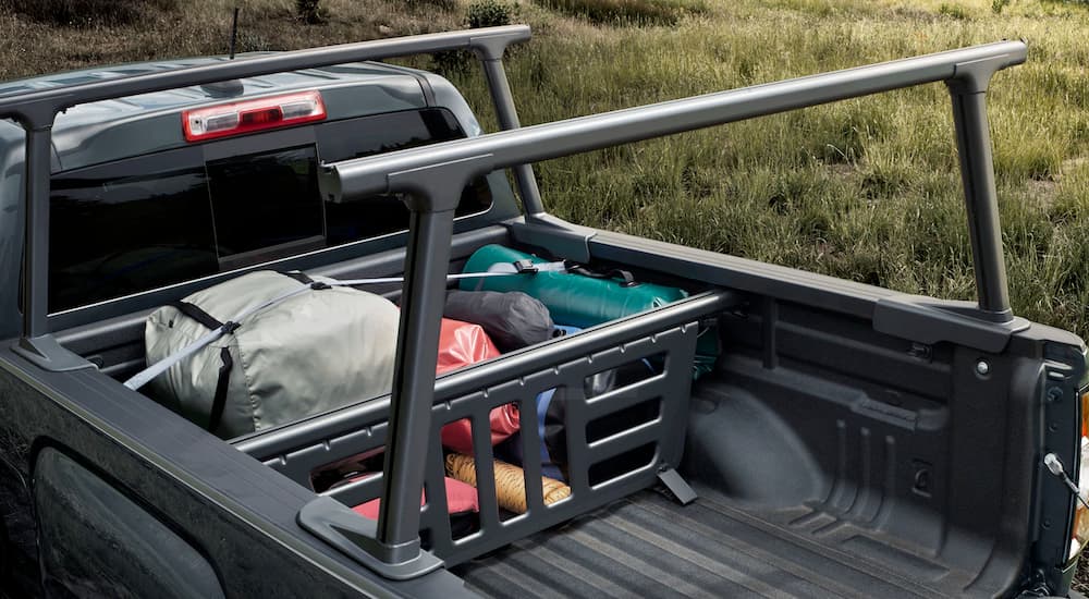 Camping gear in the bed of the 2019 GMC Canyon is shown.