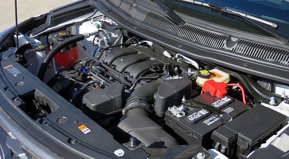 A 2019 Ford Explorer engine is shown.