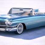 A blue 1959 Cadillac Eldorado is parked on a desert flats.
