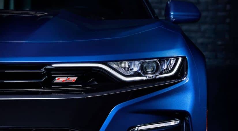 A close up of the headlight on a 2019 Chevy Camaro SS.
