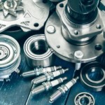 OEM and aftermarket parts are on a table from a car parts store.