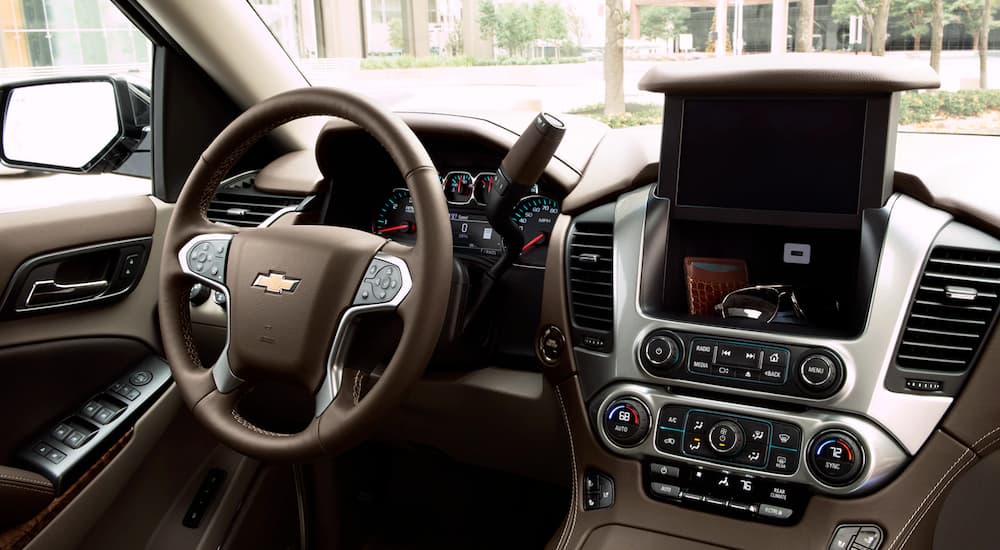 The interior features in a 2019 Chevy Suburban are shown.