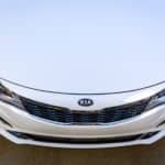 A birds eye view of the hood on a white 2020 Kia Optima.