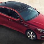 A bird's eye view of a red 2020 Kia Optima parked.