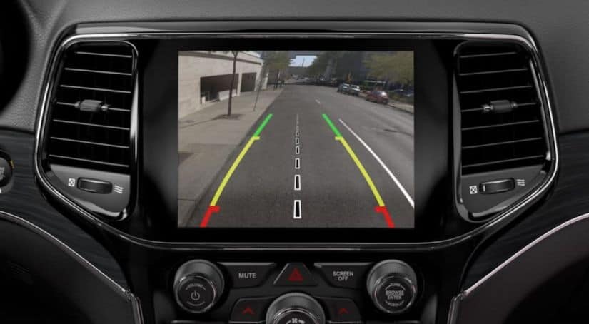 The touchscreen inside a 2019 Jeep Grand Cherokee is displaying the back-up camera.
