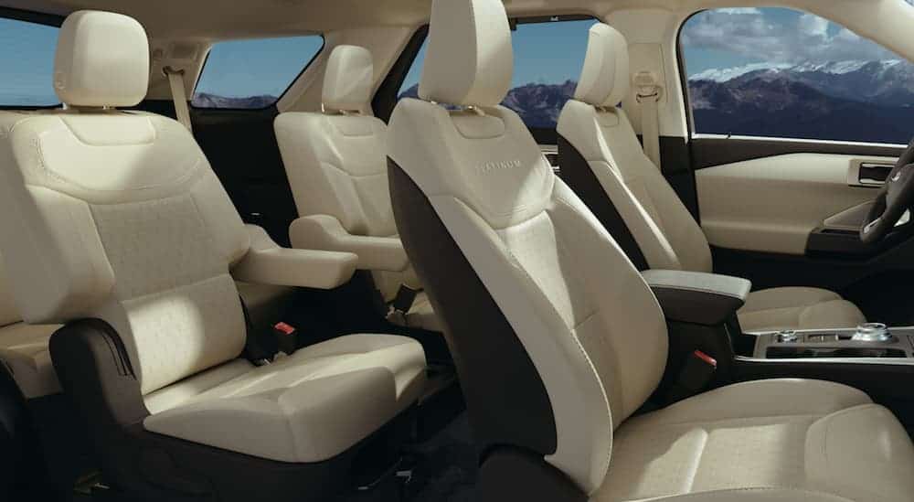 The tan and black 3 row seating interior of a 2020 Ford Explorer in shown.