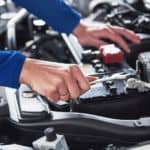 A mechanic is working on a customer's car.