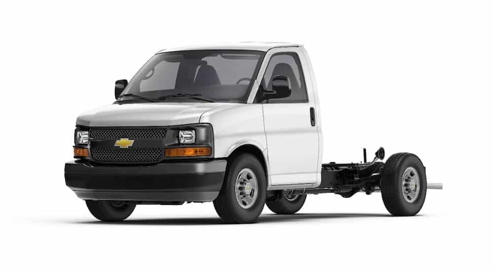 A white Chevy Express van with only the cab.