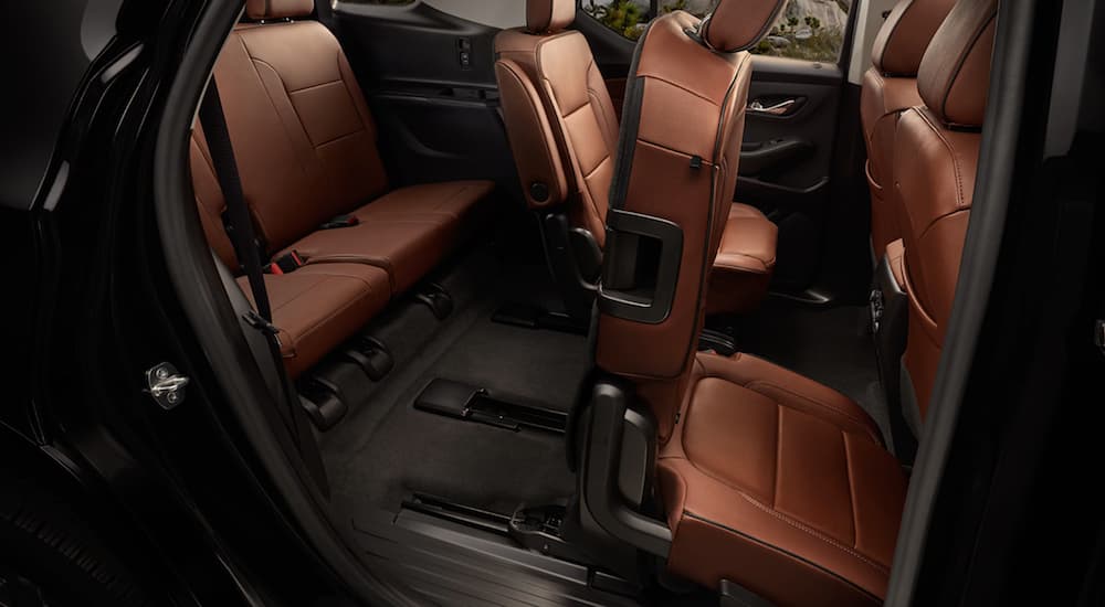 A side view of the brown leather seats with smart slide seating is shown.