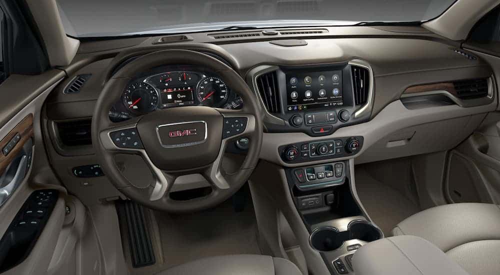A drivers view of the front tan and brown leather interior of a 2020 GMC Terrain Denali is shown. 